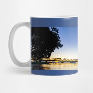 Tauranga's historic railway bridge panorama silhouetted by golden sunrise Mug